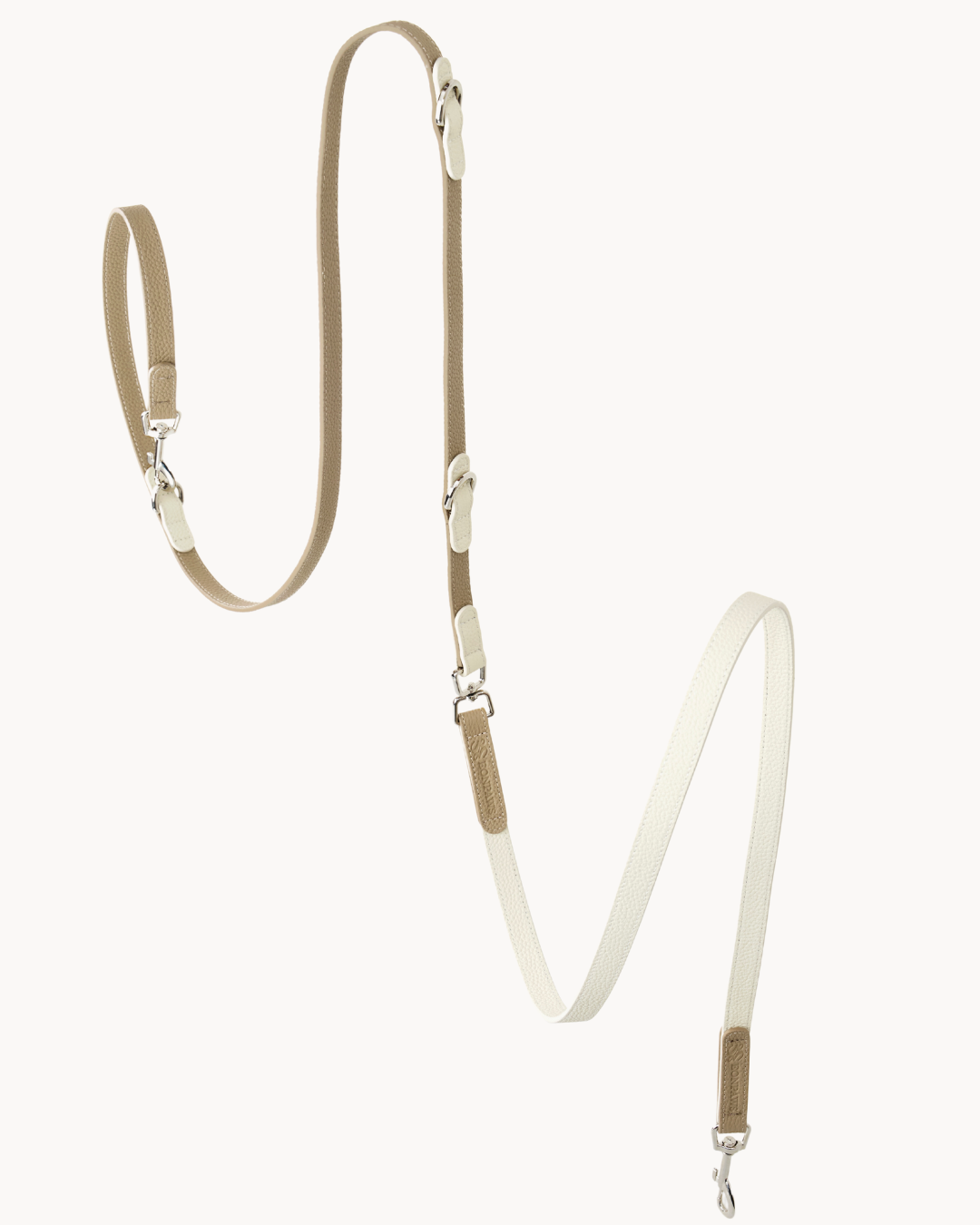 The versatile leather leash is lightweight yet practical, with refined elegance. Three 360° swivel snaps offer convenience as hand-held, cross-body, or waist-worn.#color_Vanilla Taupe